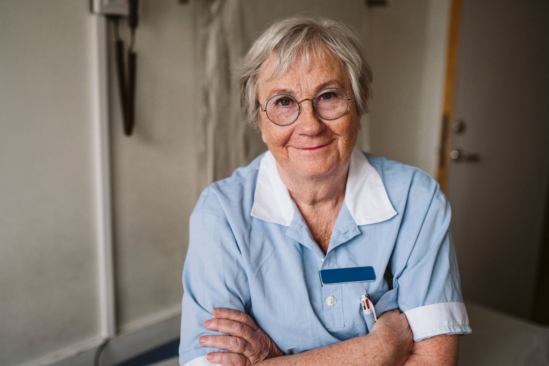 Older nurse looking straightforward smiling