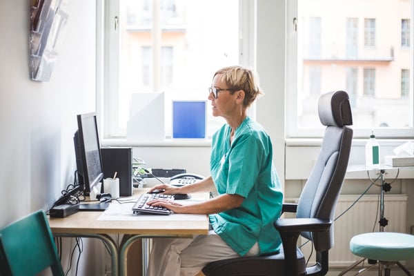 Nurse in front of computer