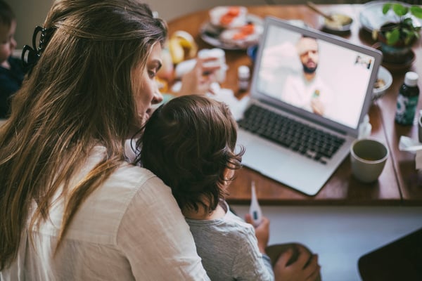 Woman and child in front of laptop