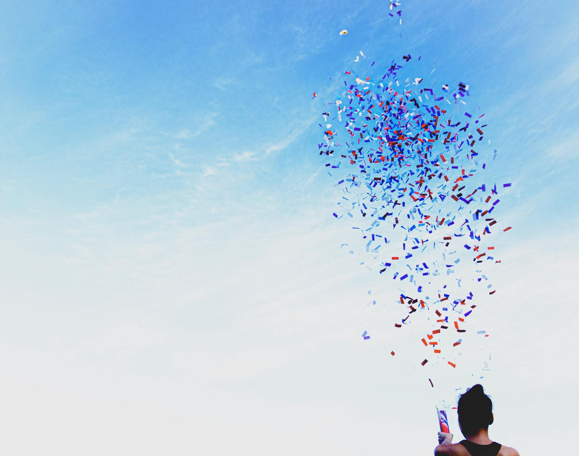 Woman spreading out confetti